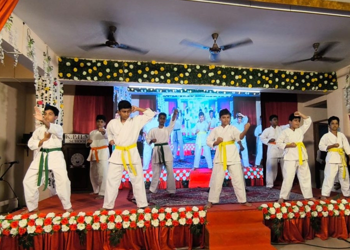 Students conducting experiments in the science lab at KPILM International School
